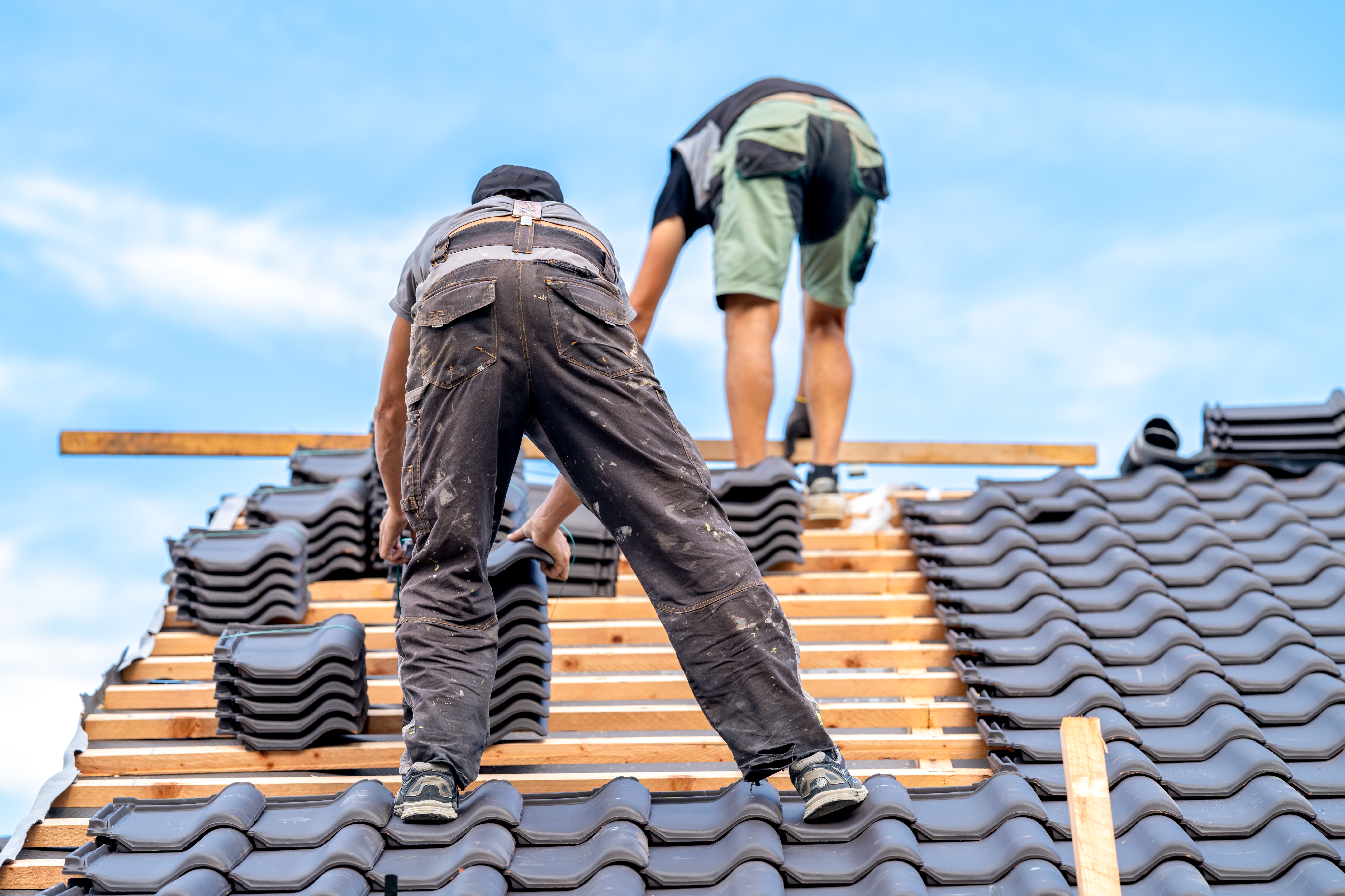 Roofing team working on residential installation